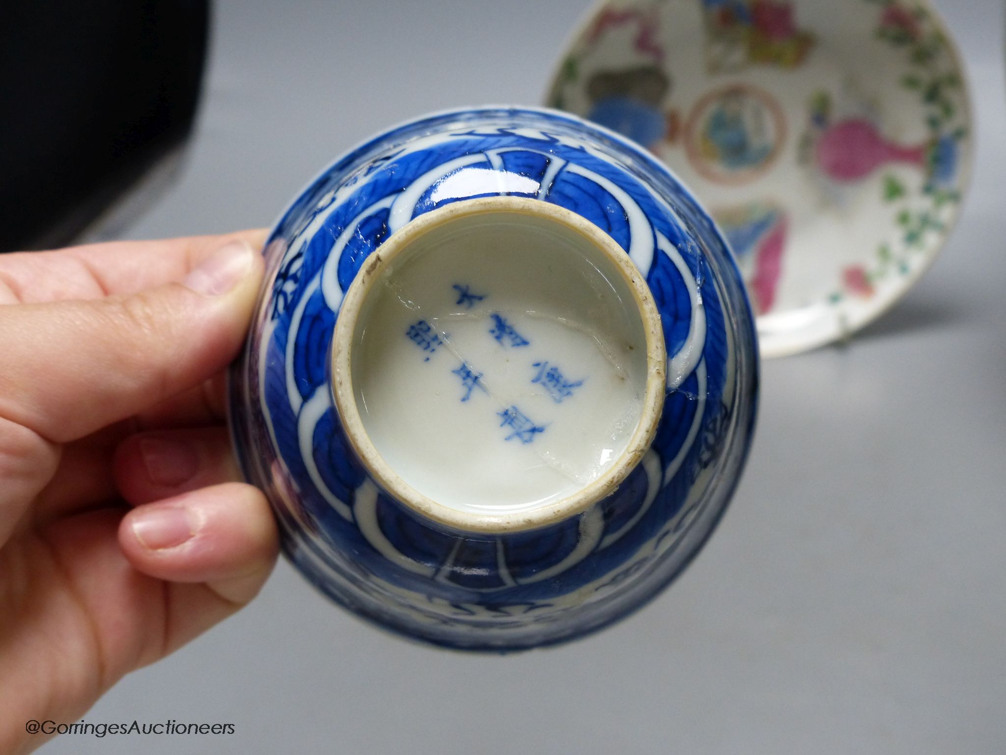 A 19th century famille rose bowl and stand, a blue and white cup, a famille rose jar and a stone carving of two monkeys